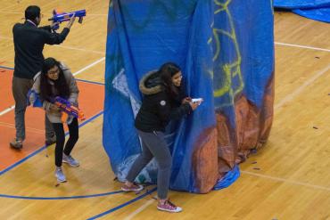 Hackers take a break for a Nerf battle in Kenney Gym.