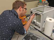 As part of a senior design project that was demonstrated at Engineering Open House, CS students modified a 3D printer to precisely place icing onto Oreo cookies.