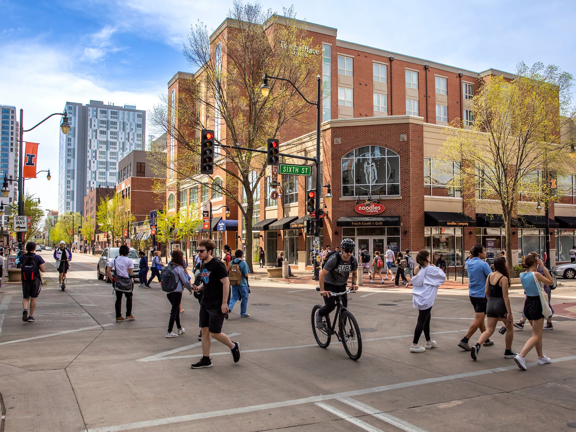 People walk on Green Street.