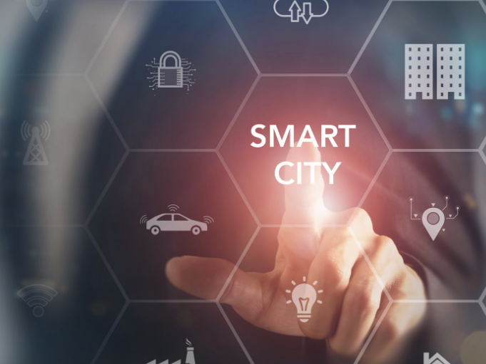 Hand touches the words "Smart City" with blue background and blurred icons.