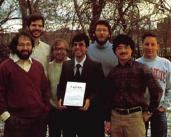 The winning team (from left): Stephen Wolfram, Stephen Omohundro, Arch Robison, Steven Skiena (holding the TABLET), Bartlett Mel, Luke Young, and Kurt Thearling
