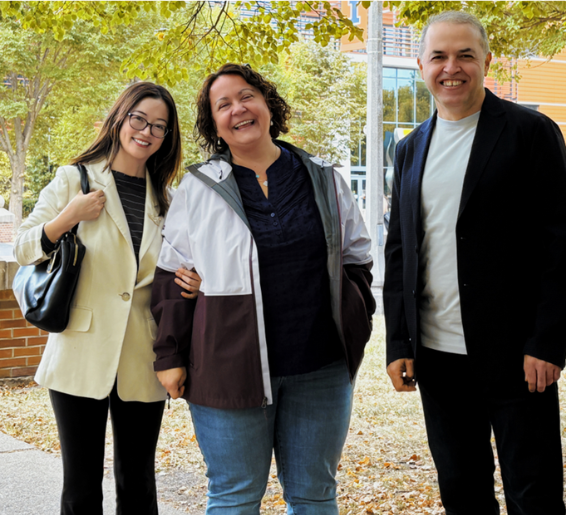 Heng Ji (bottom left), founding director of AICE, celebrates the close of the fall 2025 AICE Symposium with Illinois and Amazon speakers and guests.