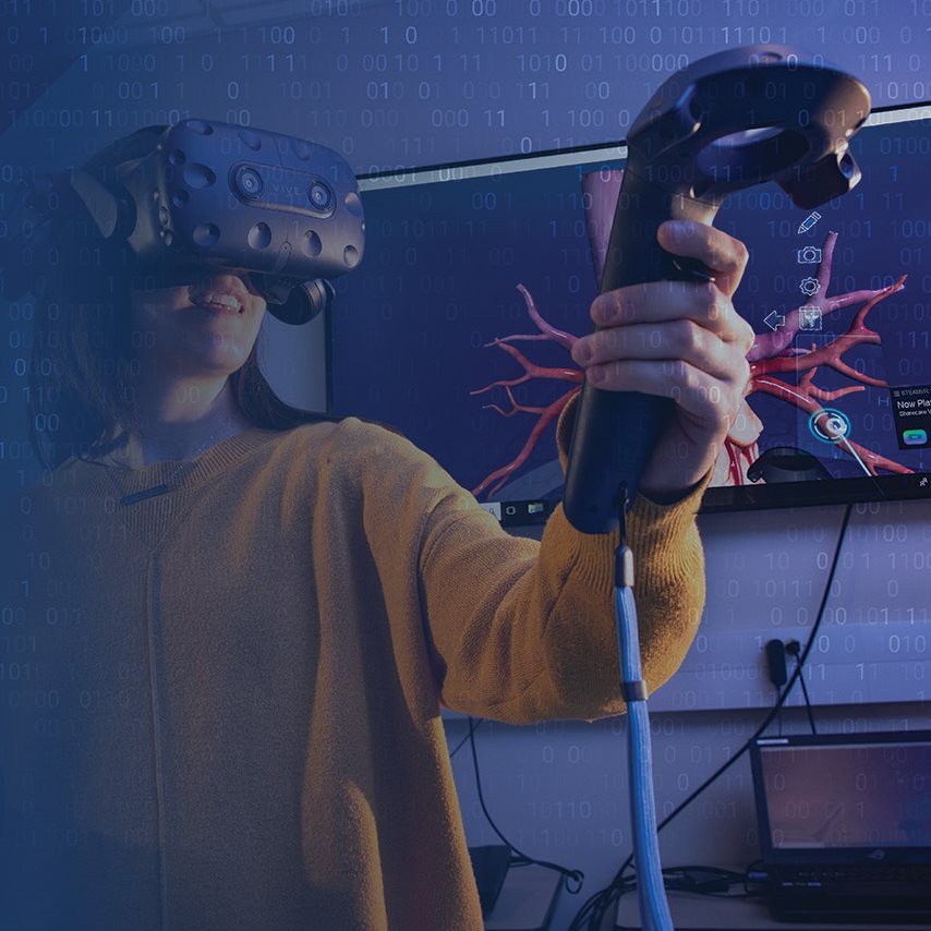 Dark blue background with a person wearing a VR headset, pointing a hand device, and a heart image on the screen in the background.