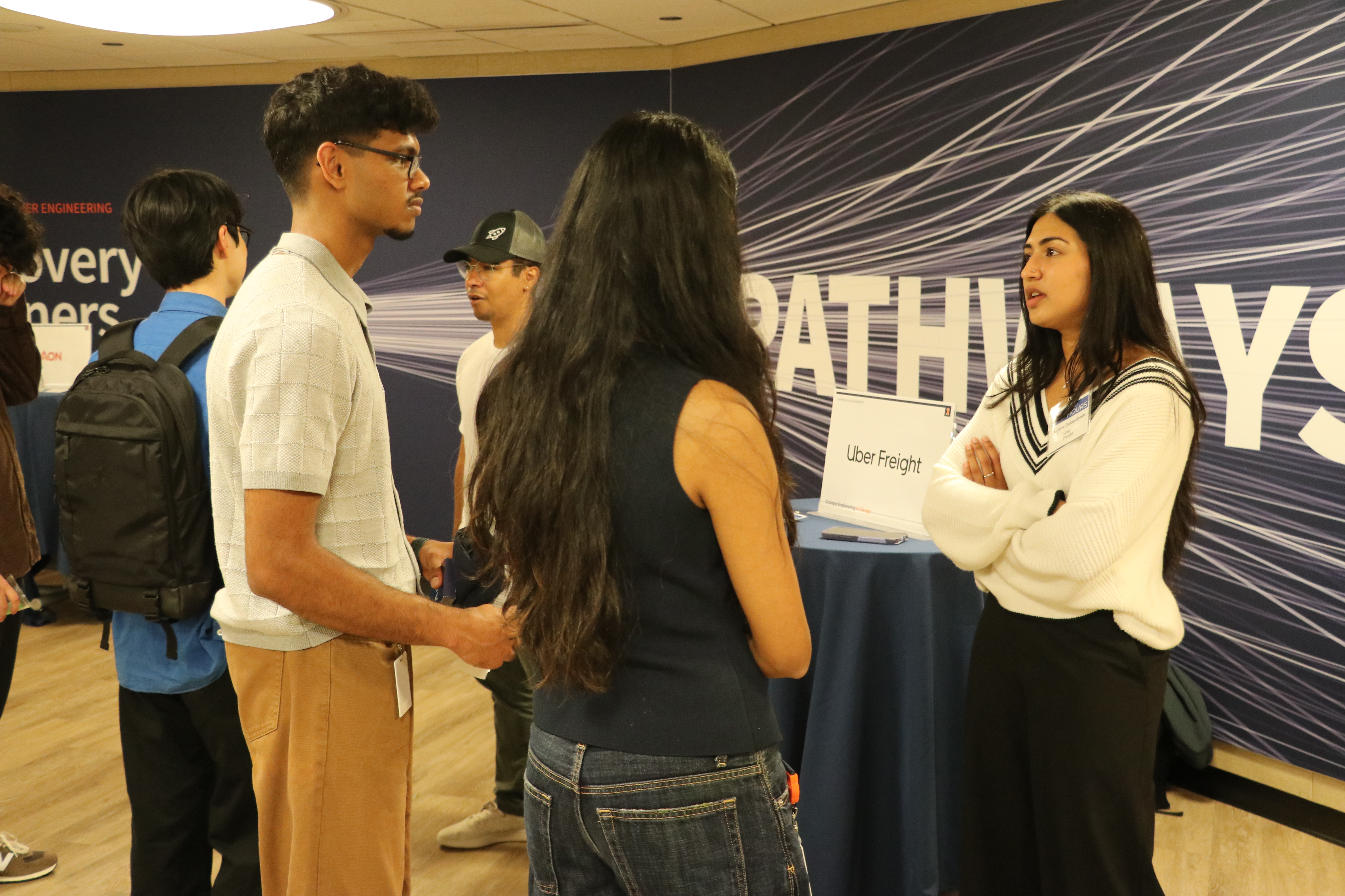 A group of MCS Chicago students converse at an MCS Chicago After Hours event