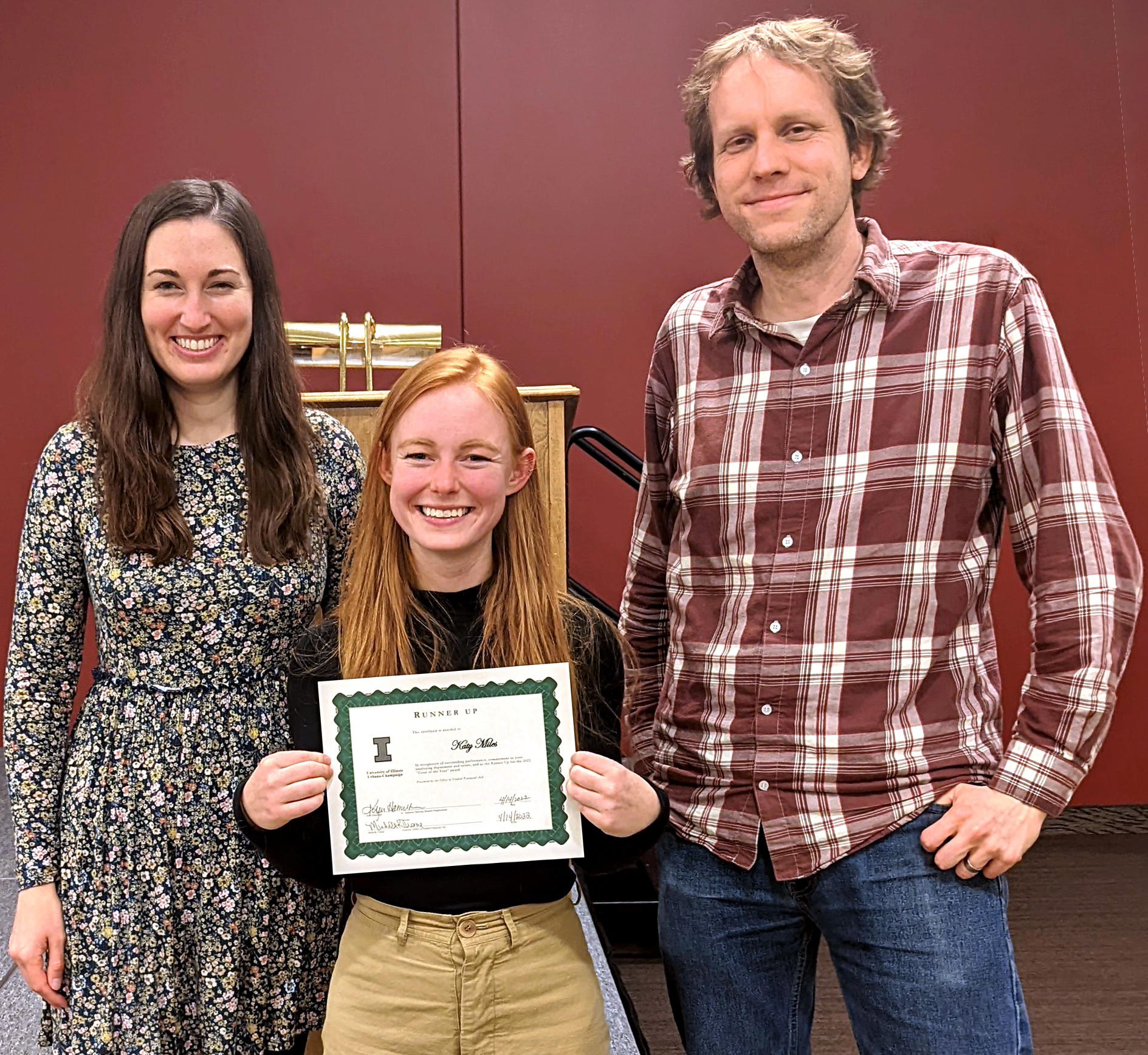 Illinois CS professor (far right) pictured with Statistics student Katy Miles, middle with 2022 Tutor of the Year Award, and Statistics instructor Karle Flanagan (far left).