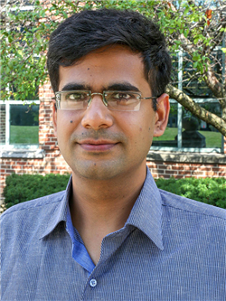 Illinois CS affiliate faculty Saurabh Gupta headshot, in an outdoor setting with a blue dress shirt.