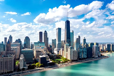 The Chicago skyline and lakefront with sunlight and clouds in 2017.