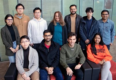 Team KingFisher group photo, including Illinois CS professor Julia Hockenmaier in the center, shot in the hallway of the Thomas M. Siebel Center for Computer Science.