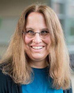 Illinois CS professor Julia Hockenmaier standing in a hallway of the Thomas M. Siebel Center for Computer Science.