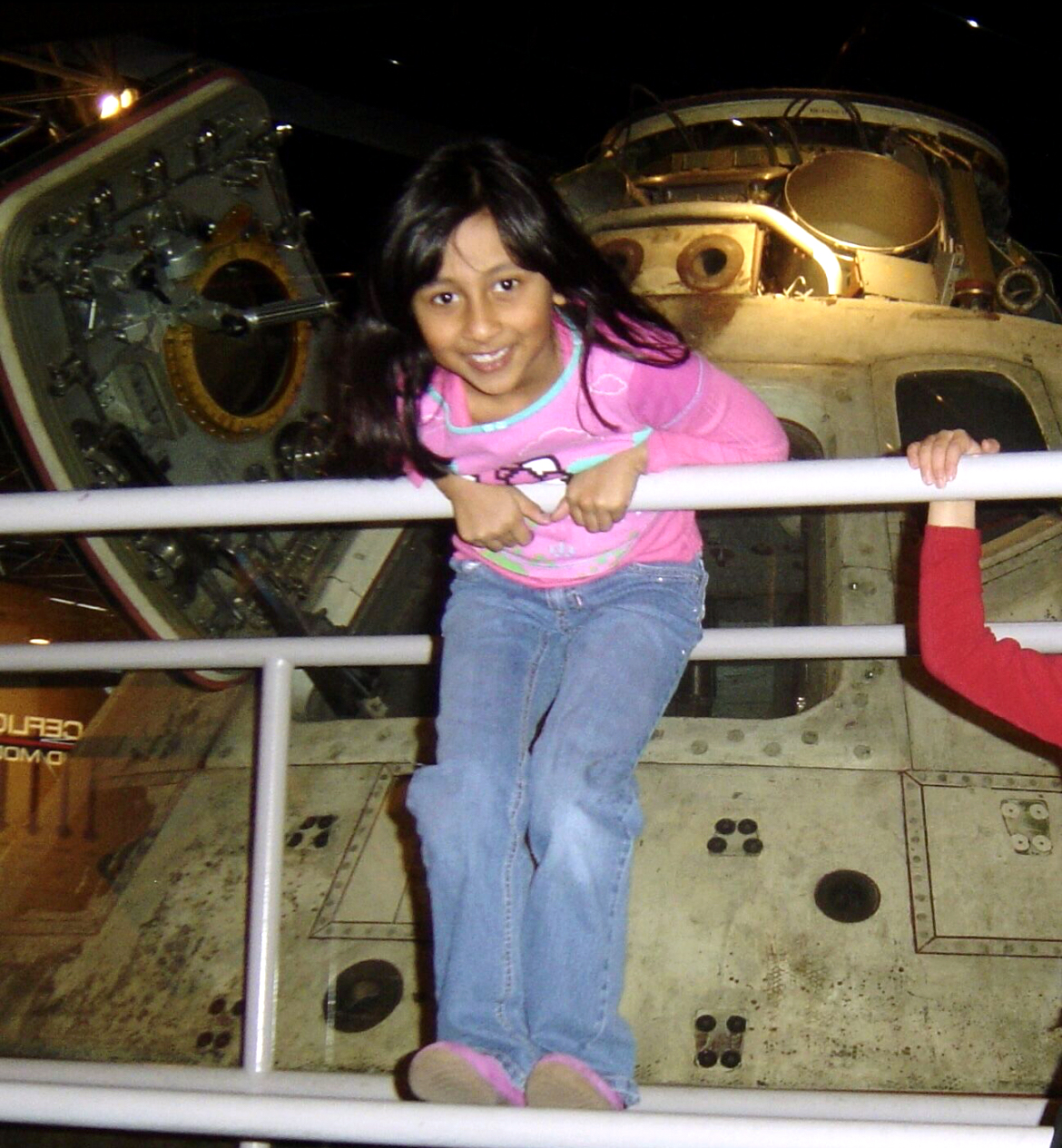 Eisha Peyyeti in front of the Apollo 8 Command Module at the Museum of Science and Industry in Chicago as a child.