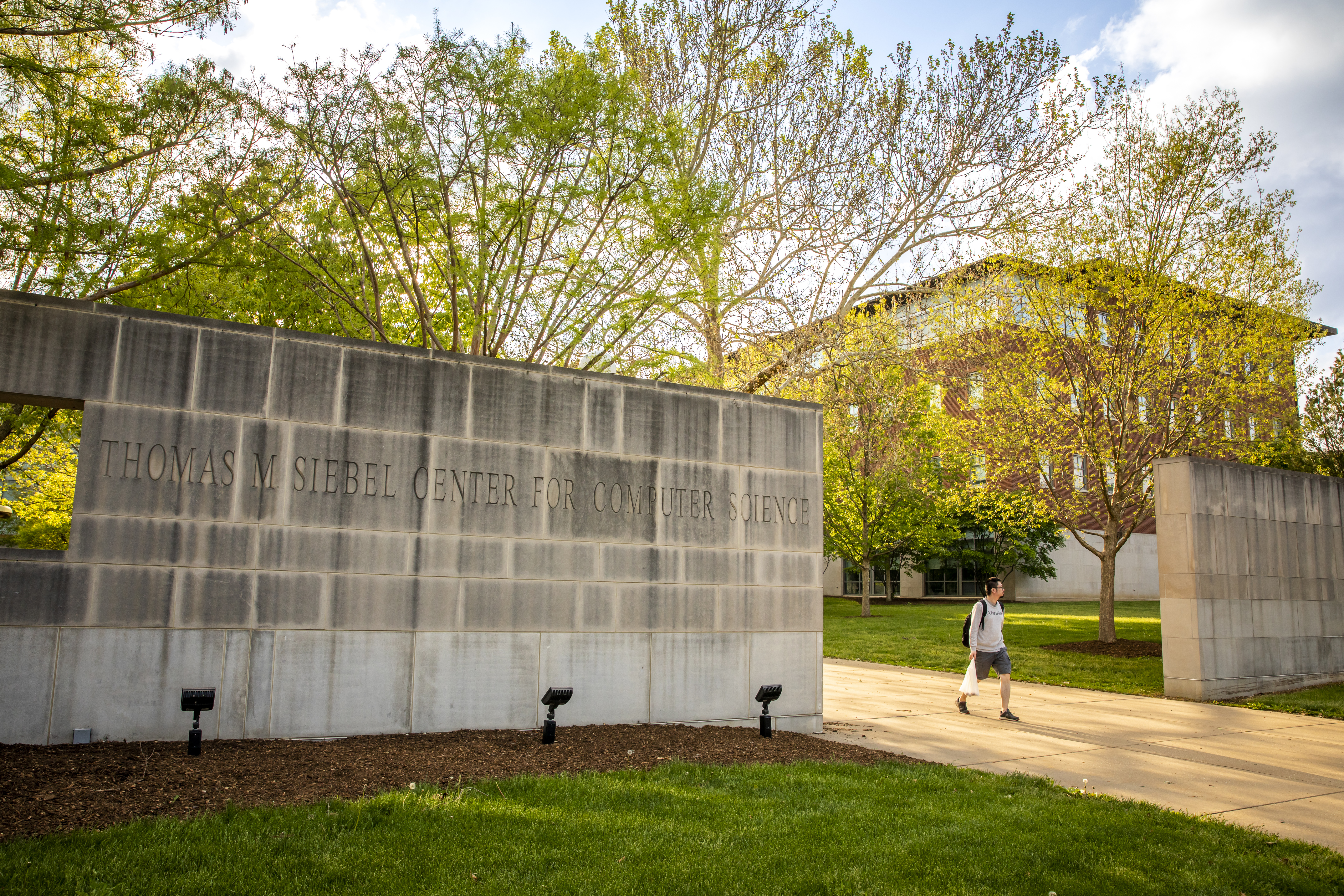 White brick entrance wall of the Thomas M. Siebel Center for Computer Science.