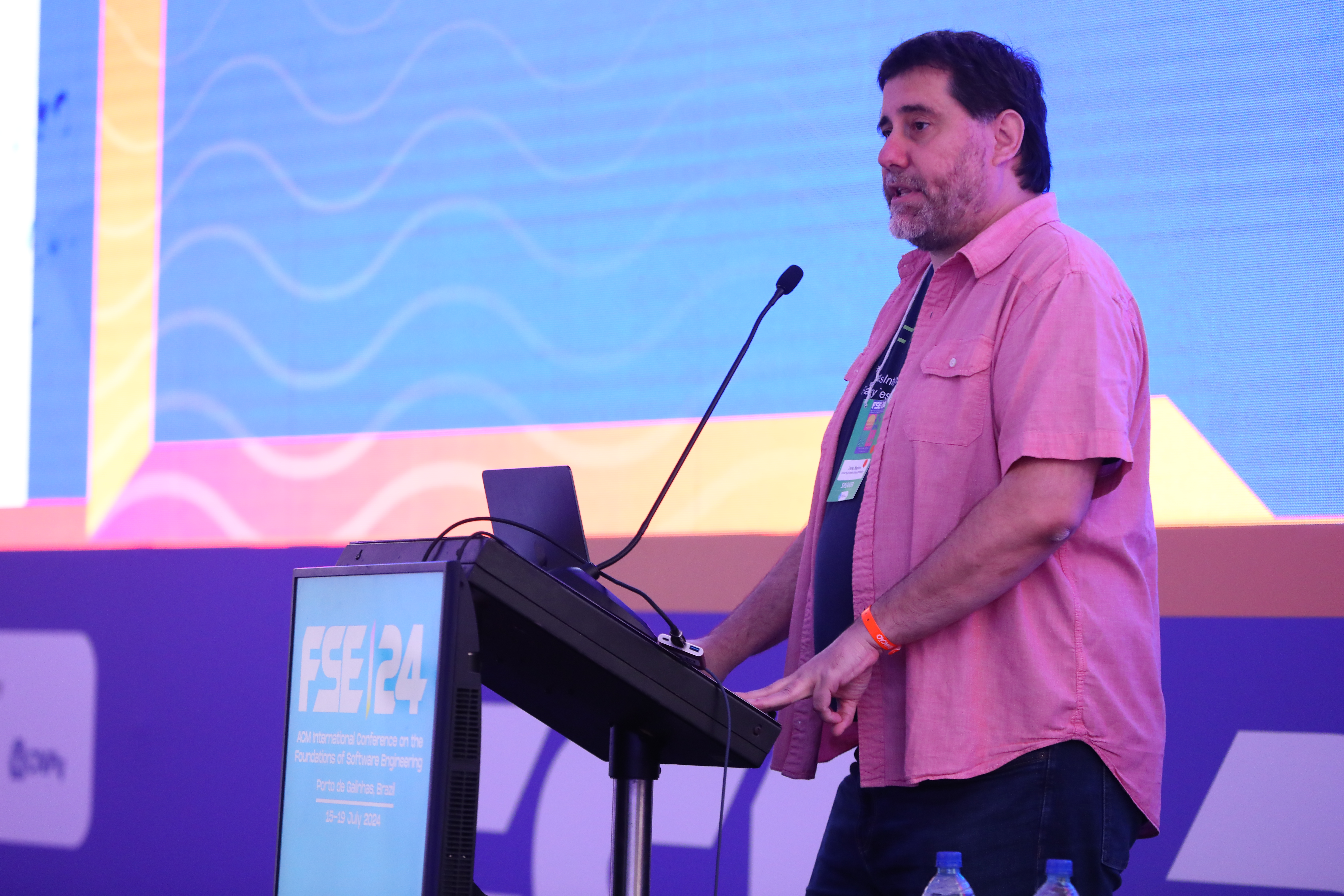 CS professor Darko Marinov accepting the Test of Time Honorable Mention award at the  FSE 2024 conference.